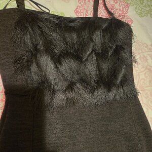 Black knit dress with fringe top.